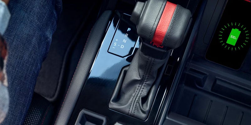 2026 Toyota Tundra in St. Louis, MO close-up of gear shift demonstrating automatic and manual driving modes for city streets and highway cruising.