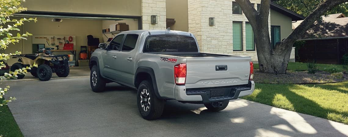 A silver 2019 Toyota Tacoma parked in a driveway