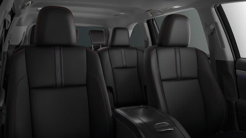 The all black interior of the 2019 Toyota Highlander