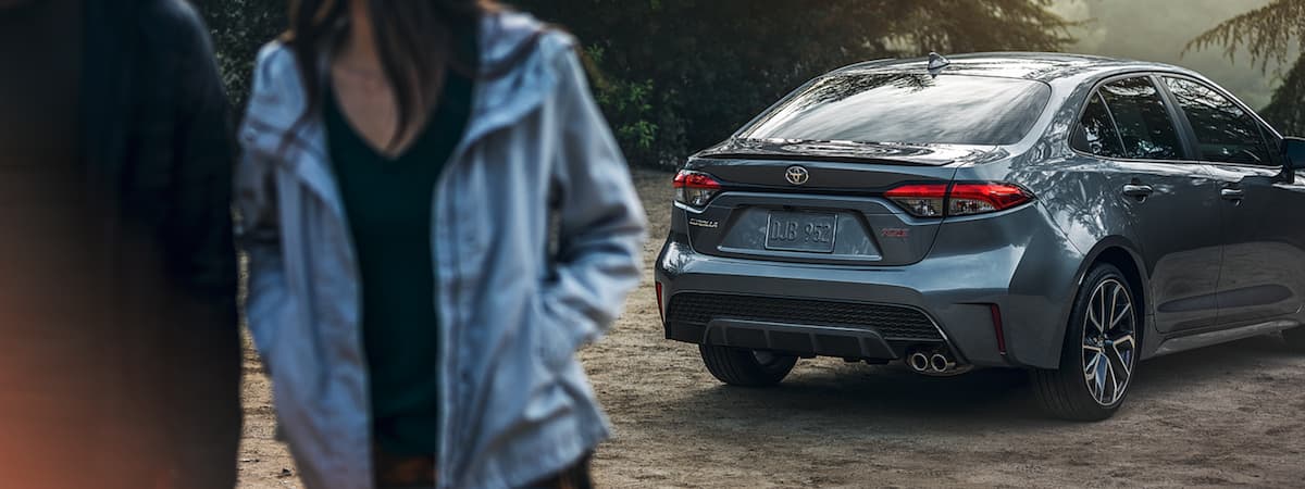 A couple walking away from their 2020 Toyota Corolla