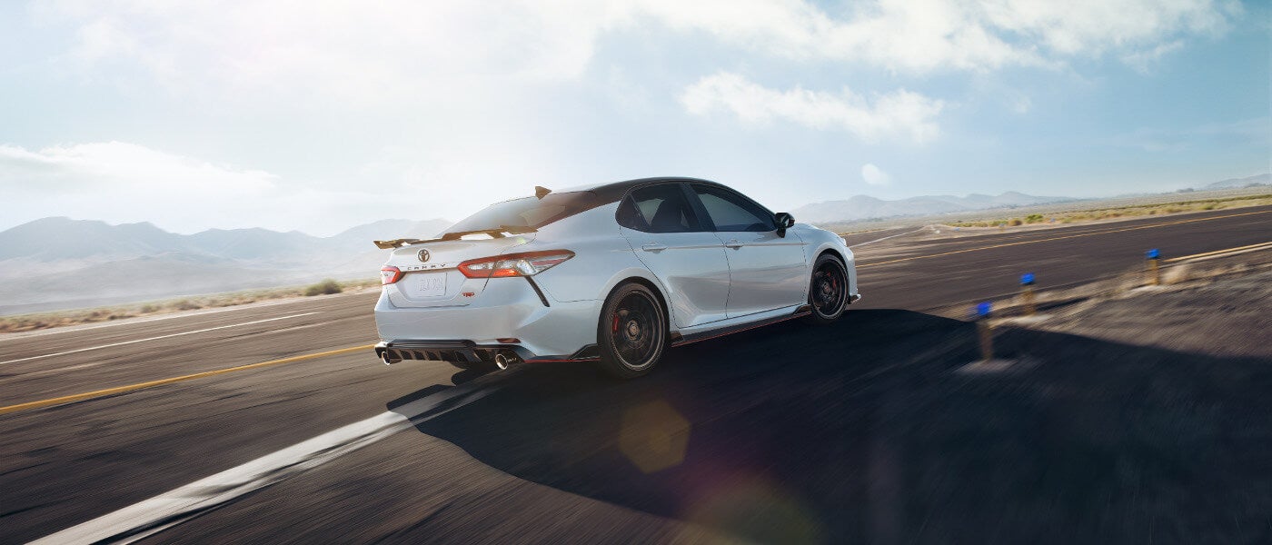 A white 2020 Toyota Camry TRD on an open track